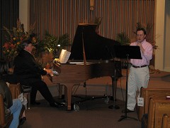 Steve Karpinsky of the St. Anne's choir singing with Steve Hall.