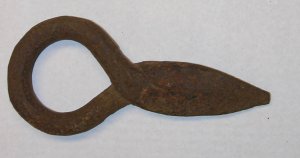 This eye hook was driven into a log end and connected to other logs to form a river boom. These booms were used to collect logs before they were driven to the mill.