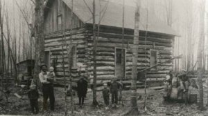 The Fred Laessig family pose in front of their log cabin on their Stratford farm. This German and Dutch clan immigrated to Marathon County in the 1870’s.