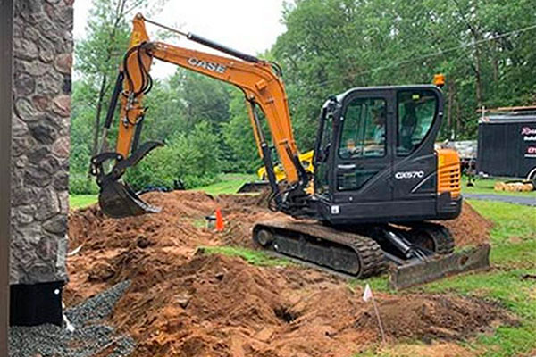 Excavating Services In Central Wisconsin Excavator Digging Up Dirt