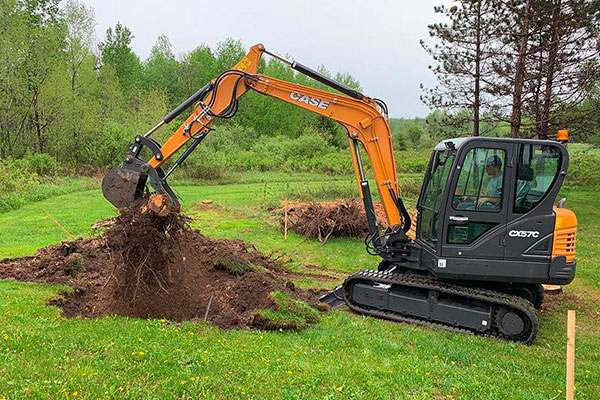 Excavating Services In Central Wisconsin Excavator Digging Up Dirt