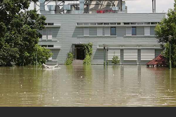 Commercial property surrounded by deep floodwater