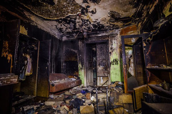 Interior of a house devastated by fire Fire-damaged home interior