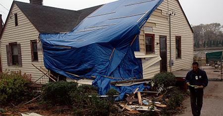 Storm Damage to House House tarped from storm damage