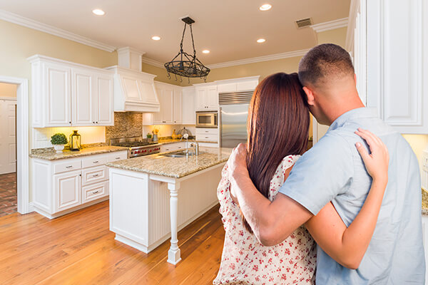 Couple seeing their new kitchen after being remodeled. Home Remodeling in Wausau, WI